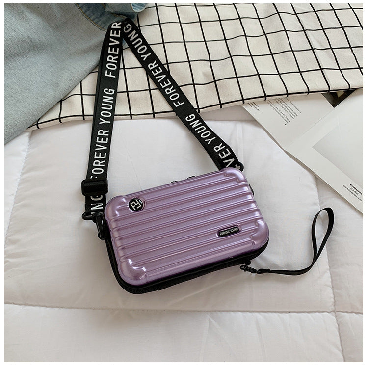 Mini suitcase in the shape of a shoulder bag