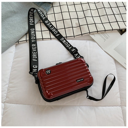 Mini suitcase in the shape of a shoulder bag